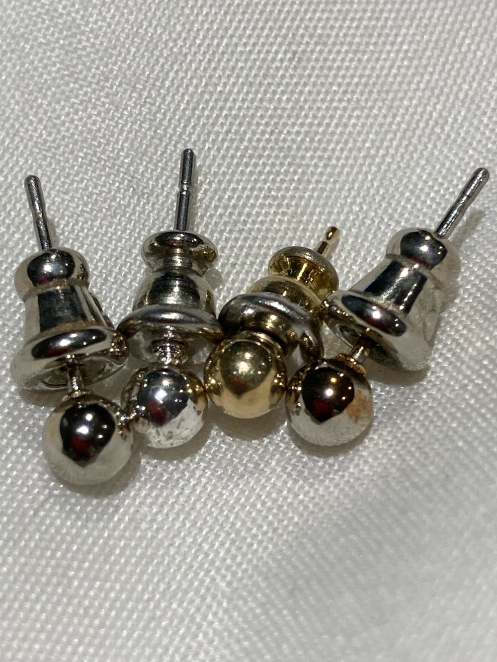 4 mismatched stud earrings